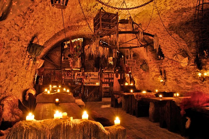 Step into a medieval tavern under dim candlelight where a lavish five-course meal unfolds alongside mesmerizing performances transporting guests to a lively past filled with music and intrigue.